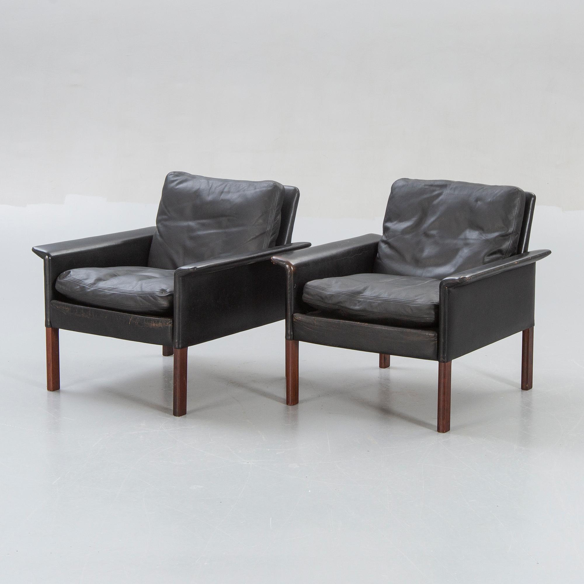A pair of 1960s leather easy chairs.
