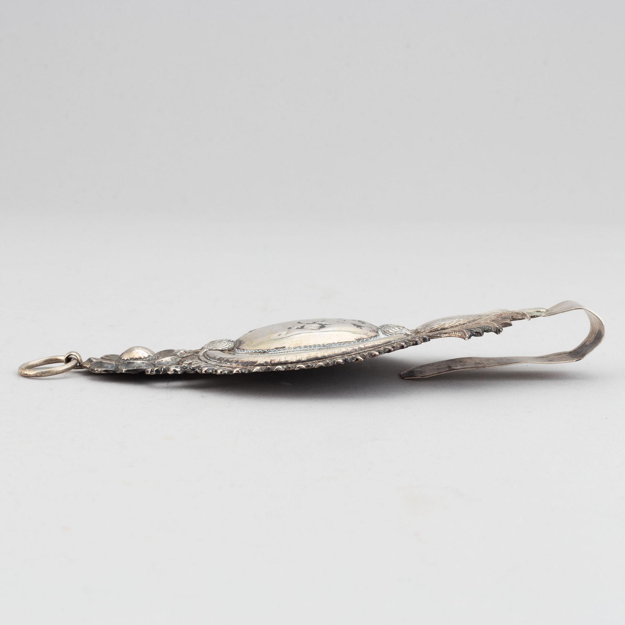 A pair of 19th century silver curtain tie-backs.