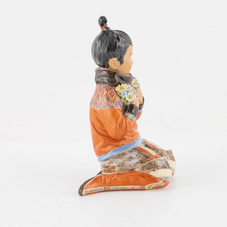 A Royal Copenhagen porcelain figure of an innuit from Grönland, Denmark, early 20th Century.