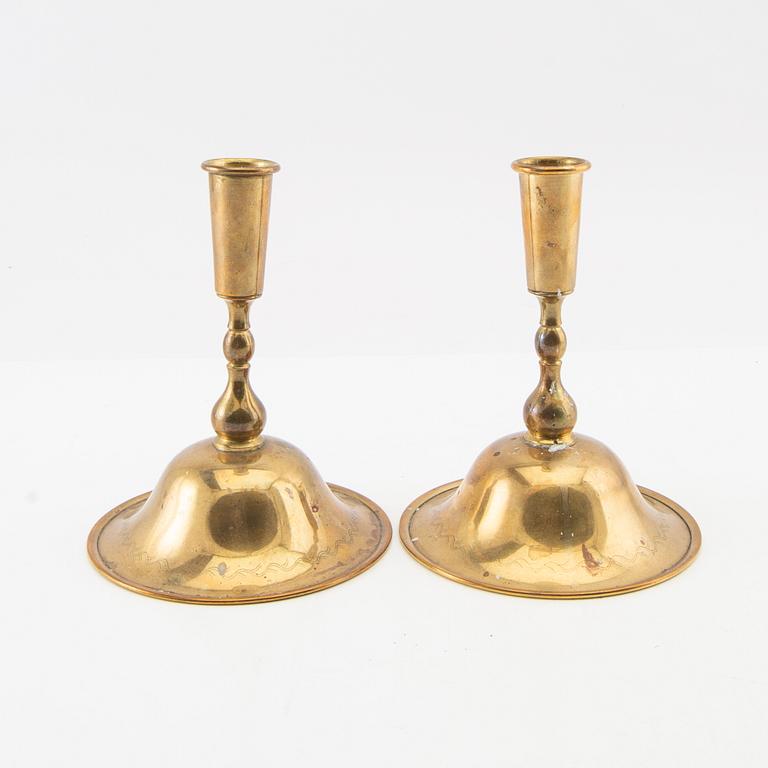 Estrid Ericson, a pair of candlesticks for Firma Svenskt Tenn, mid-20th century, brass.