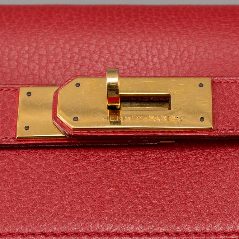 A red Epson "Kelly 40" bag by Hermès 1991.