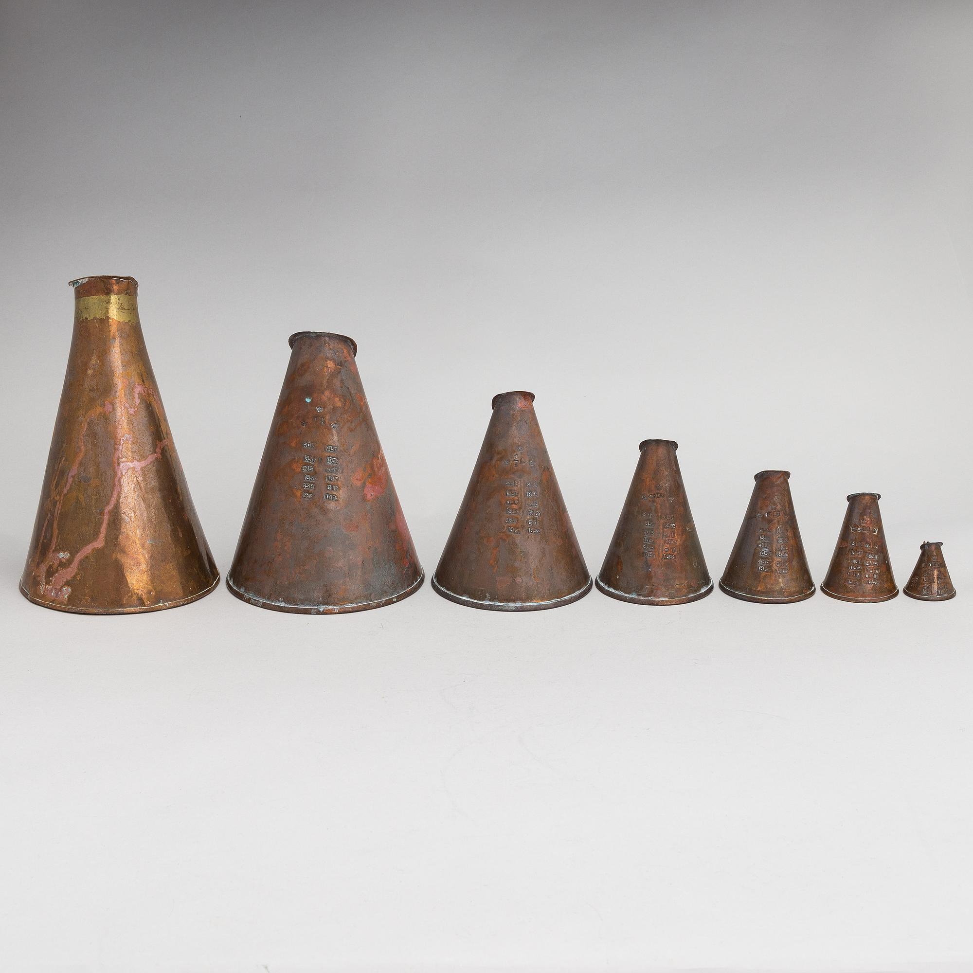 7 Swedish measuring cups from 20th century.