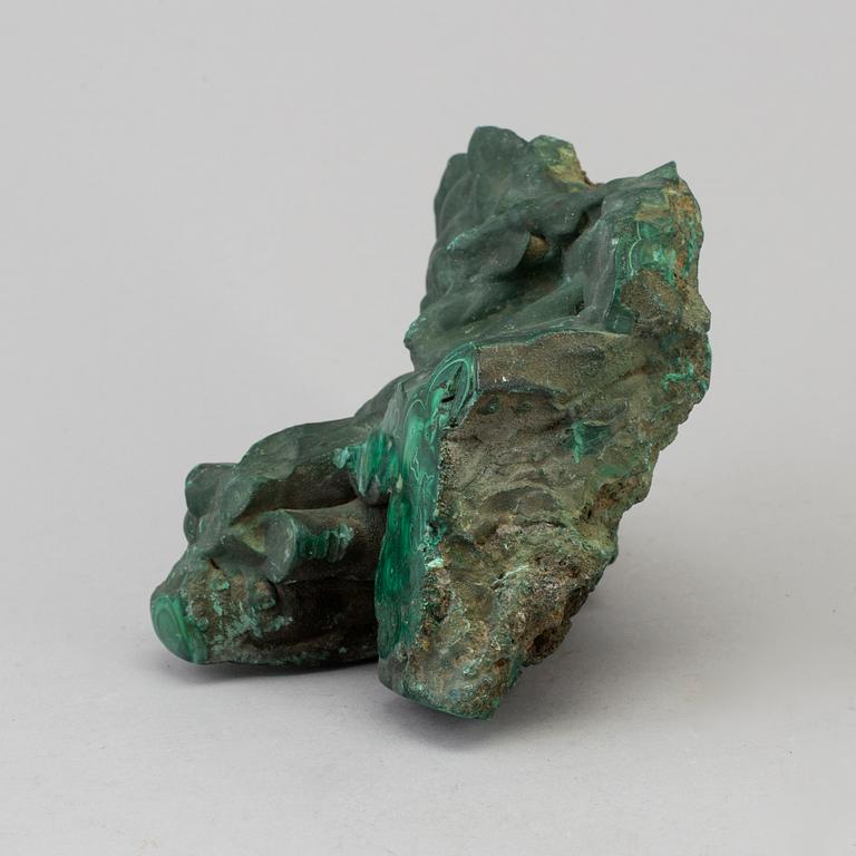 A malachite weight circa 1760 grams.