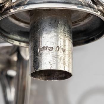 A pair of Swedish 19th century silver candelabra, marks of Gustaf Theodor Folcker, Stockholm 1871.