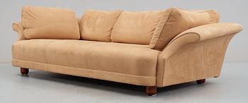 A Josef Frank 'Liljevalchs' sofa, Svenskt Tenn, reupholstered in light brown suede.