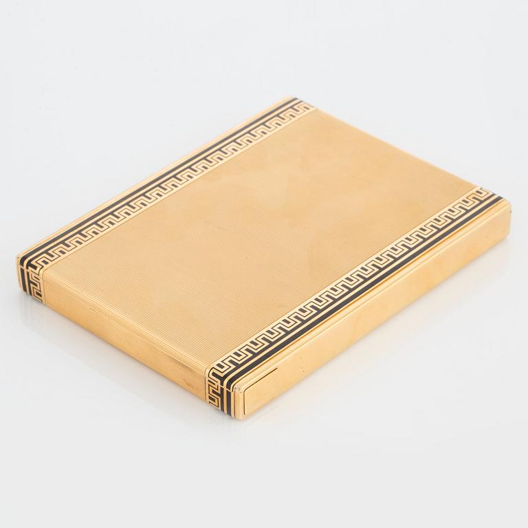 A Cartier cigarette case in 18K gold with black enamel.