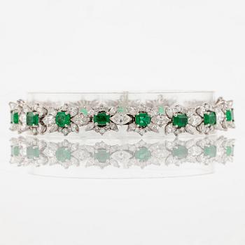 A bracelet in 18K white gold with step-cut emeralds and round and navette-shaped brilliant-cut diamonds.