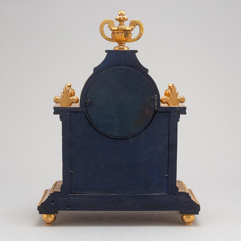 A Gustavian style mantle clock, signed C.A. Carlsson 12/12 1913 Nyköping.