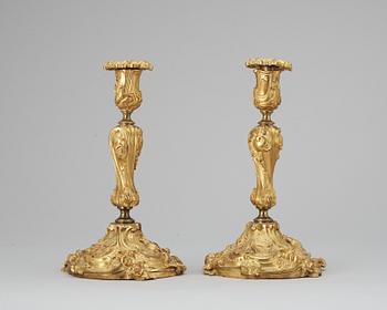 610. A pair of late 19th cent candelsticks.