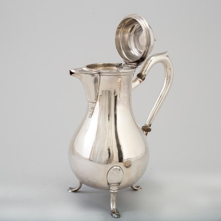 A three-piece silver coffee service from Borel & Co, Germany, mid 20th Century.
