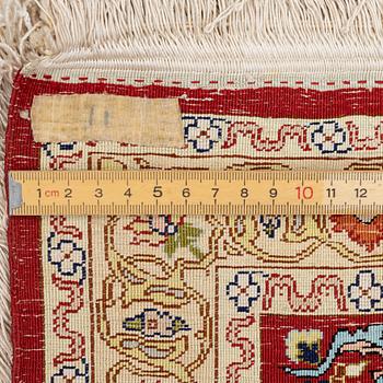 A silk and metal Hereke rug, West Anatolia, c. 58 x 39 cm.