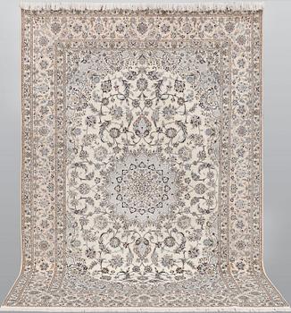 A part silk Nain carpet, c. 6LAA, ca. 310 x 209 cm.