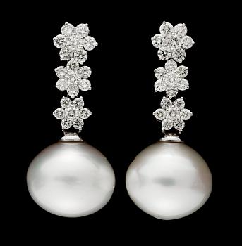 624. A pair of South Sea cultured pearl and diamond earrings.