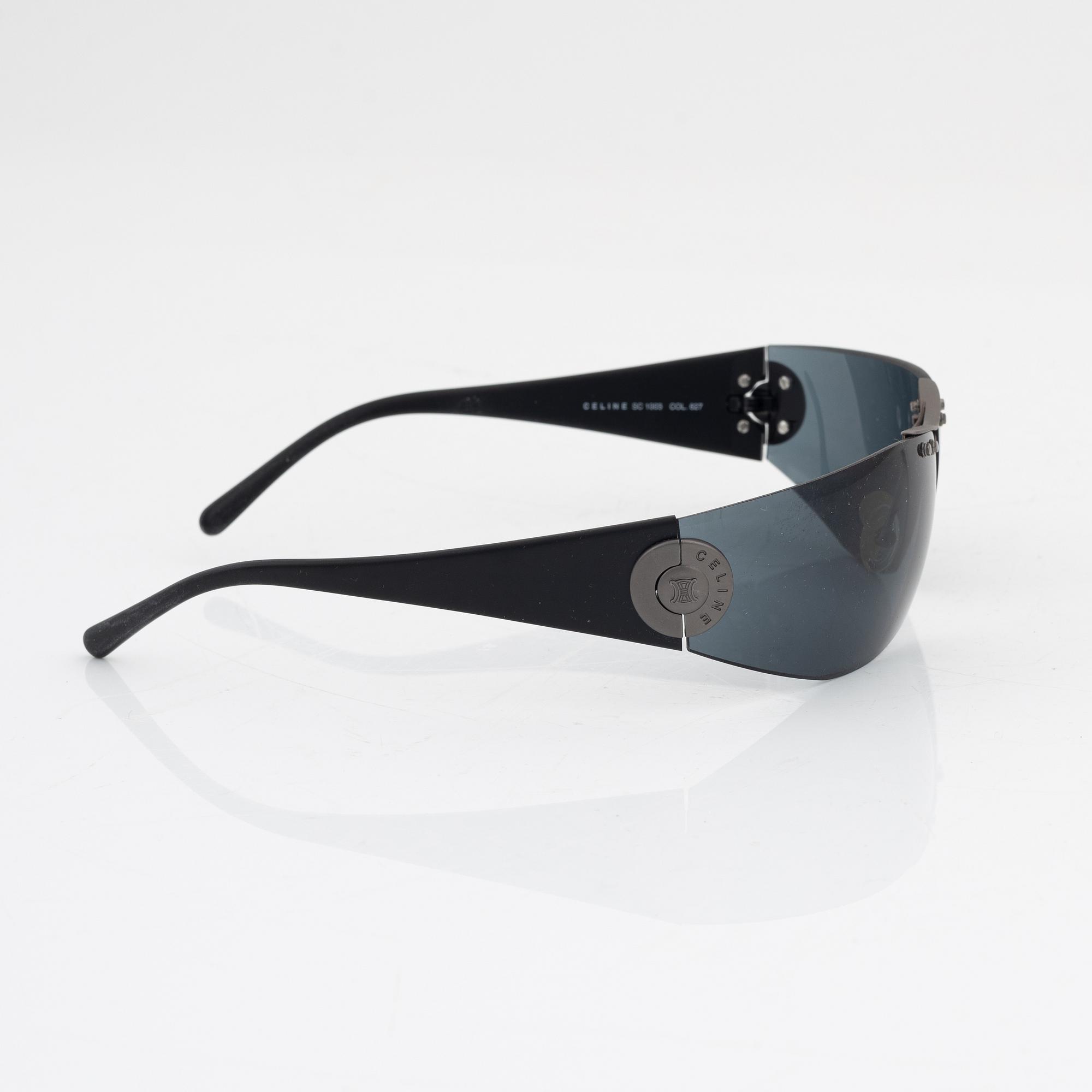 Céline, a pair of black and silver-color sunglasses.