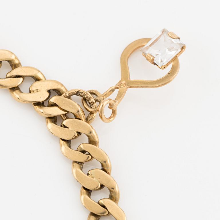 Bracelet, 18K gold, with three charms.