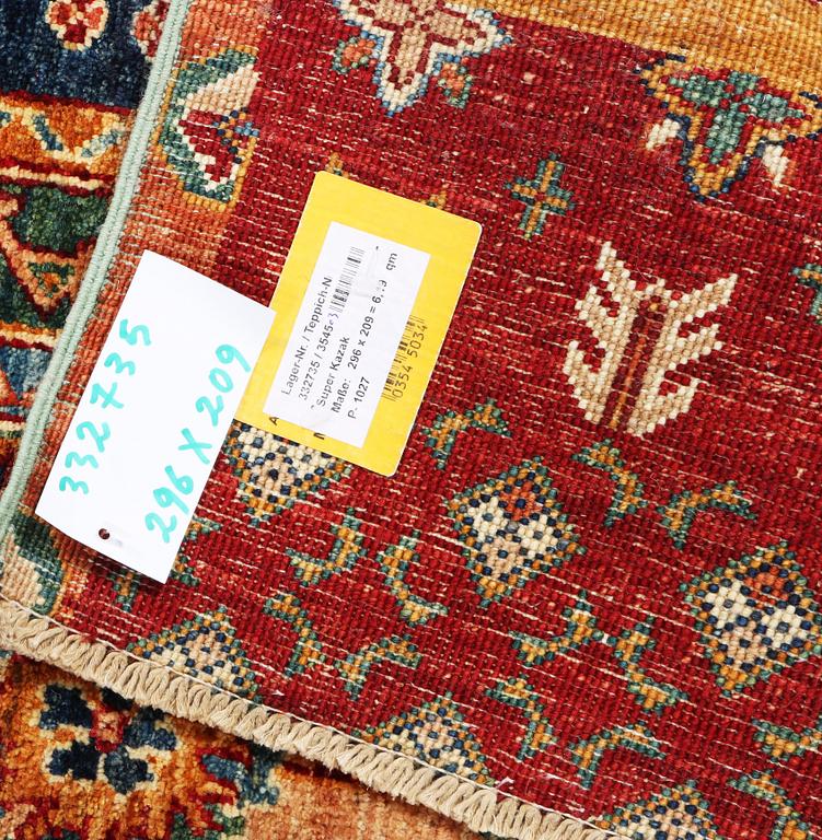 A Kazak carpet, c. 296 x 209 cm.