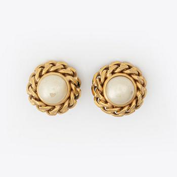 Céline, a pair of gold tone clip-on earrings.