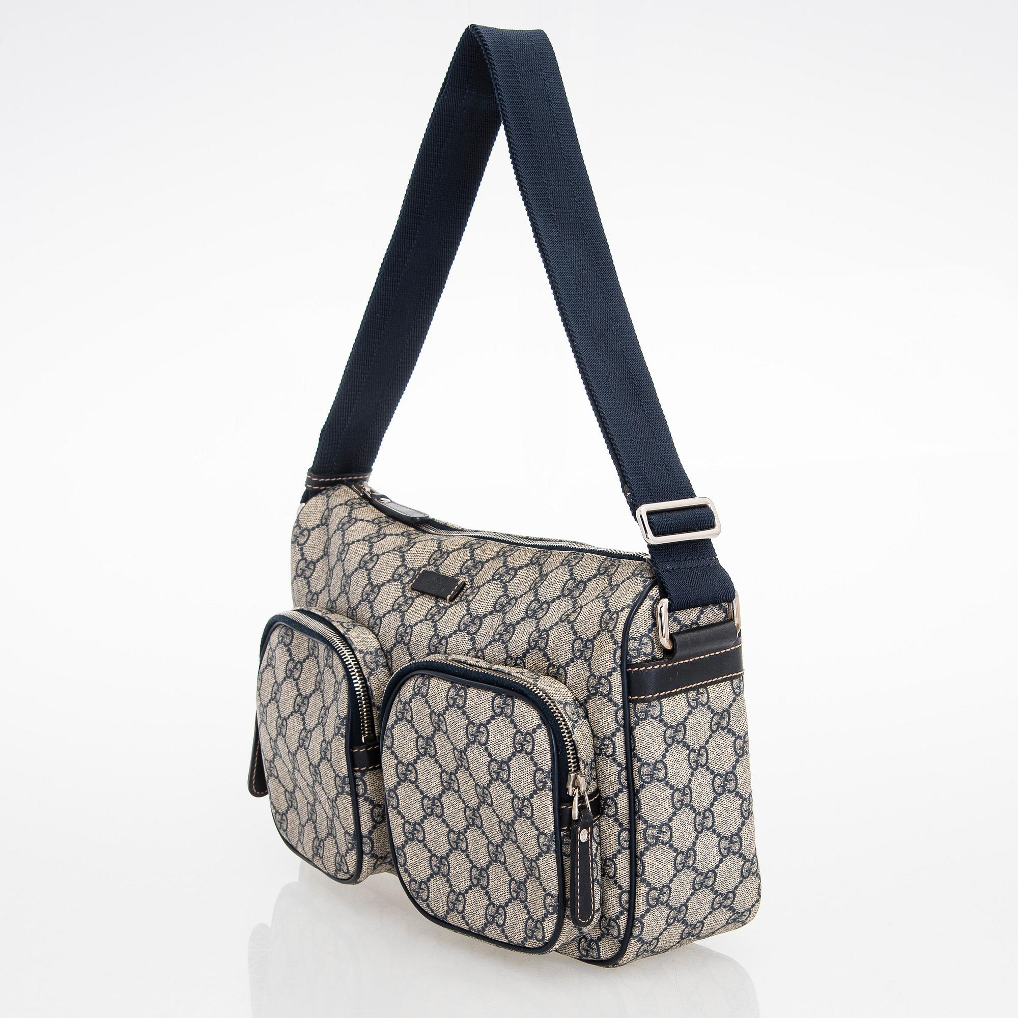 Gucci, A "GG Supreme messenger" bag.