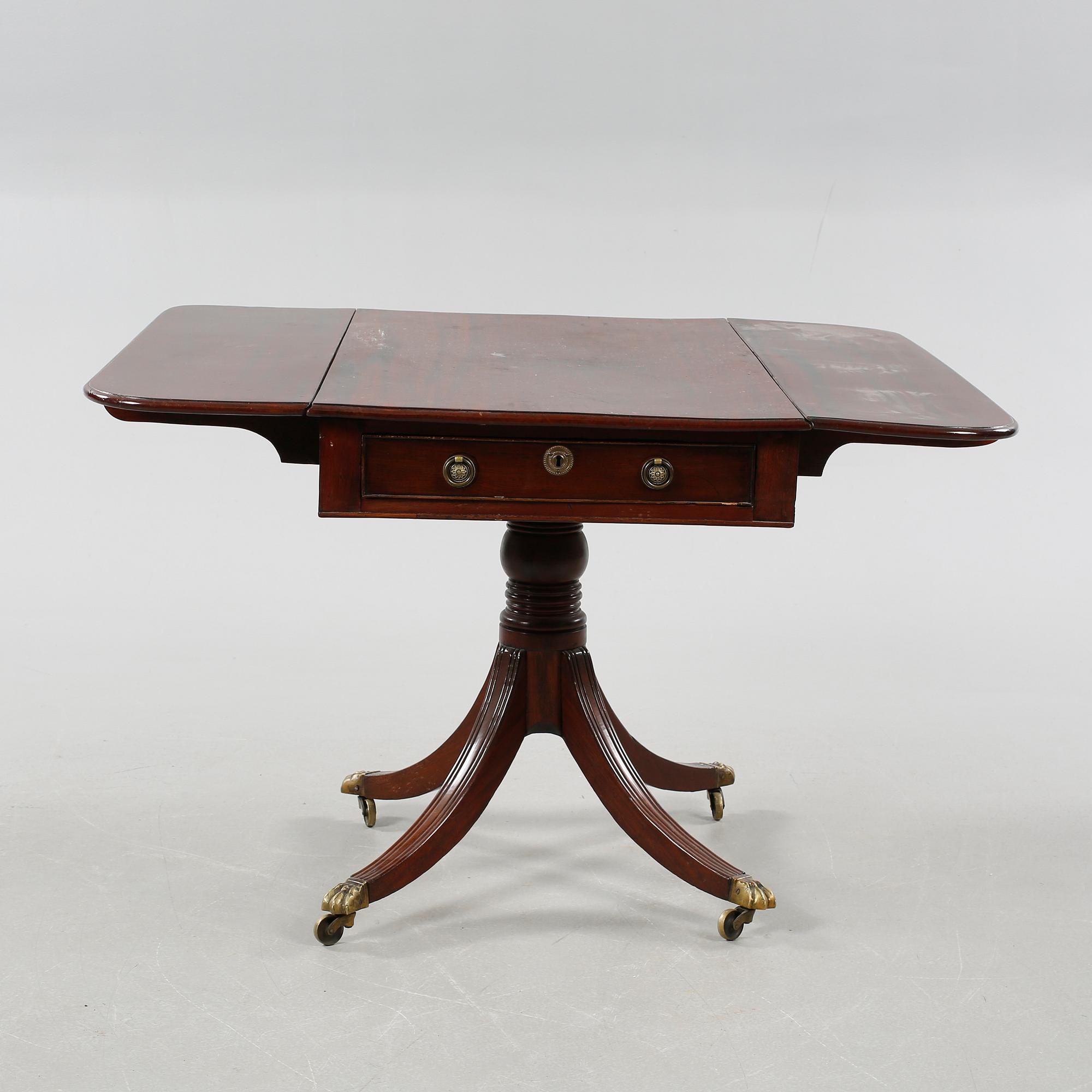 A drop-leaf table, English style, late 19th century.