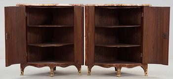 A pair of Louis XV 18th century corner cabinets by F. Reizell.