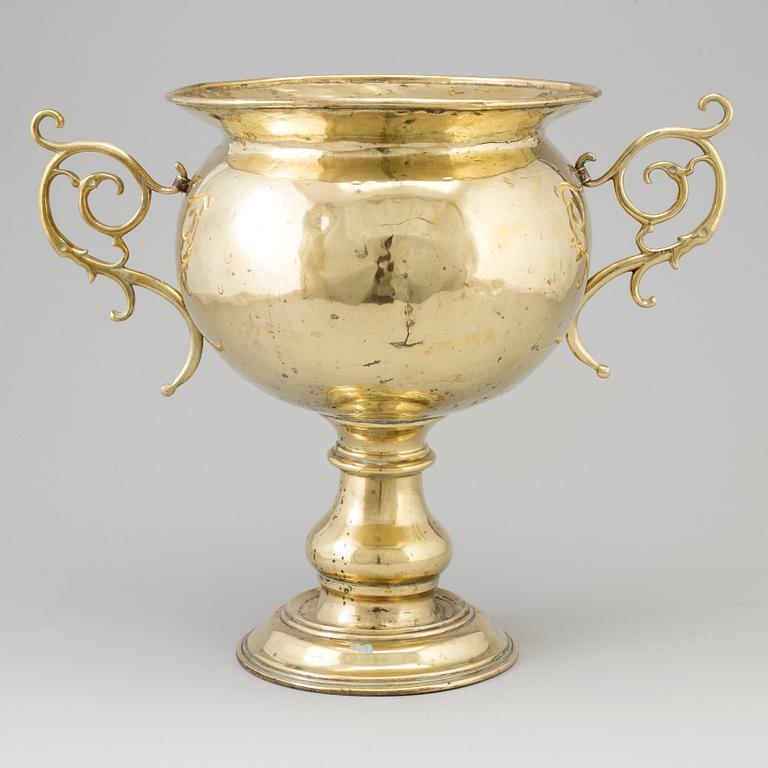 A 19th century brass champagne cooler.