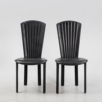 Twelve black leather 'Sossano' chairs, Quia, Italy.