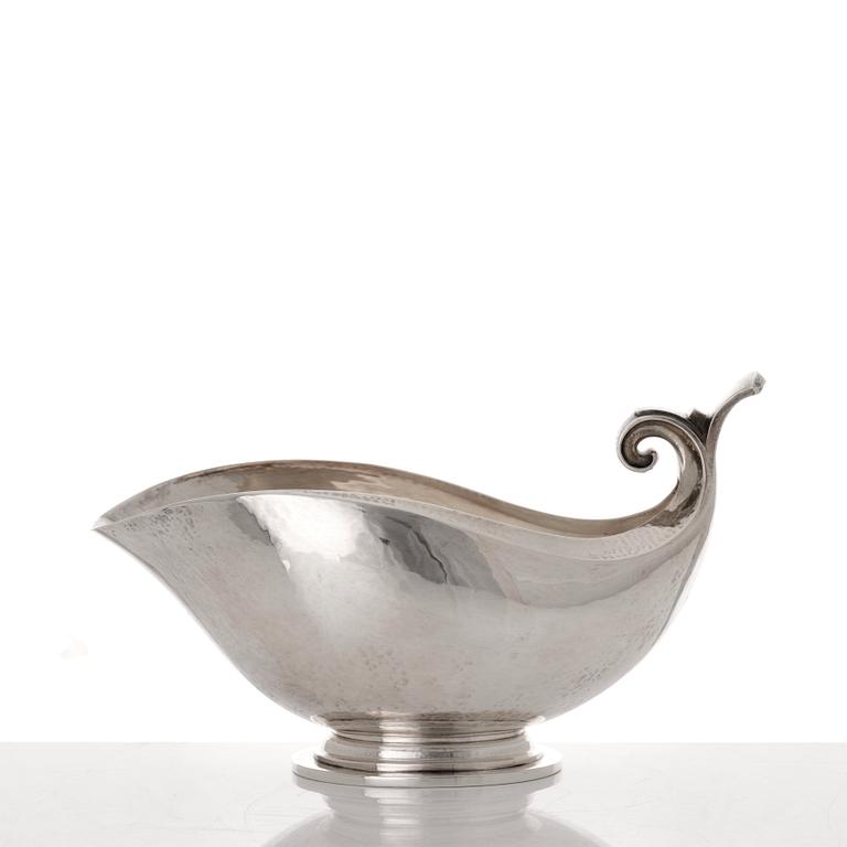 Georg Jensen, a sterling silver sauceboat and ladle, Copenhagen 1925-1945, design nr 98 and 141.