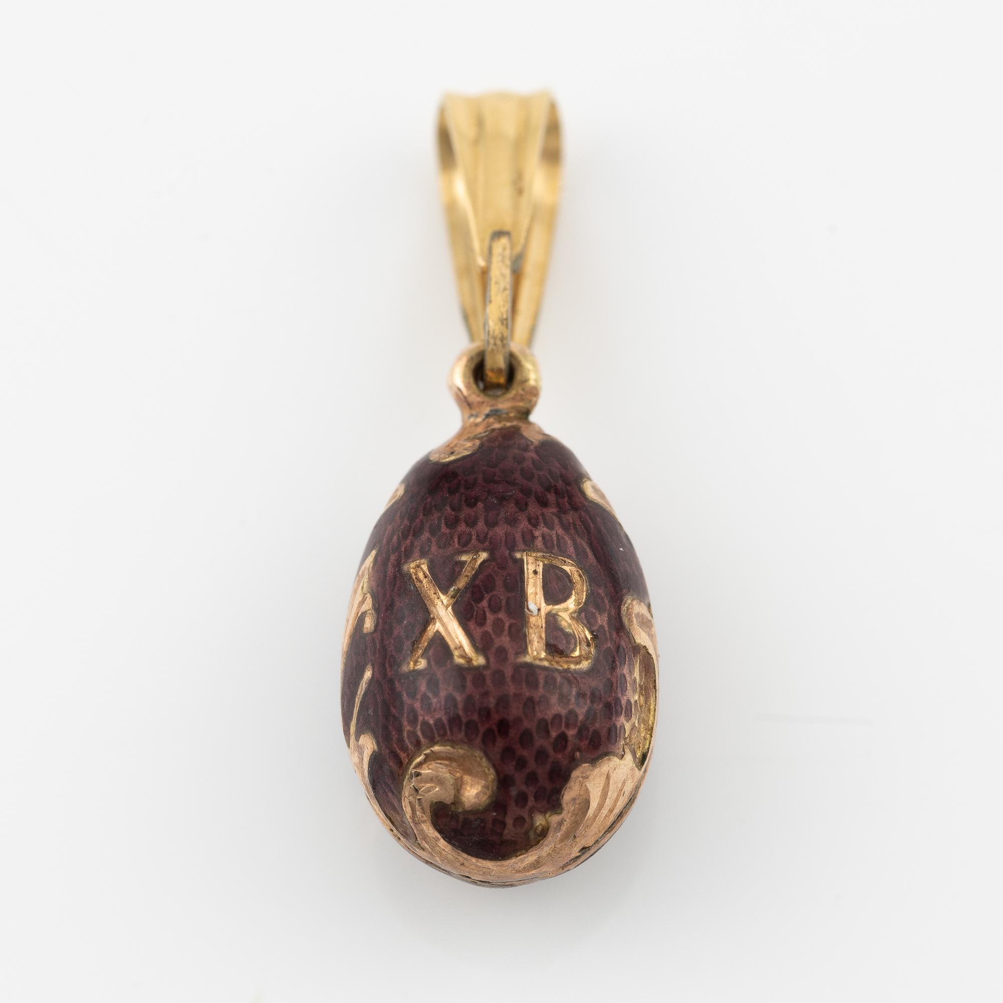Pendant, egg, gold and purple enamel.