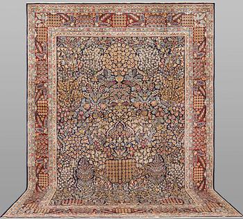 A 'Millefleur' Kerman carpet, c. 393 x 266 cm.