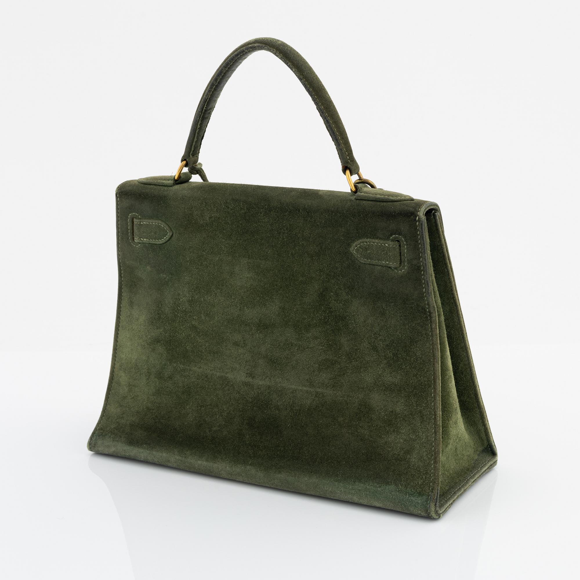 Hermès, a 1960's green suede 'Kelly 30'.