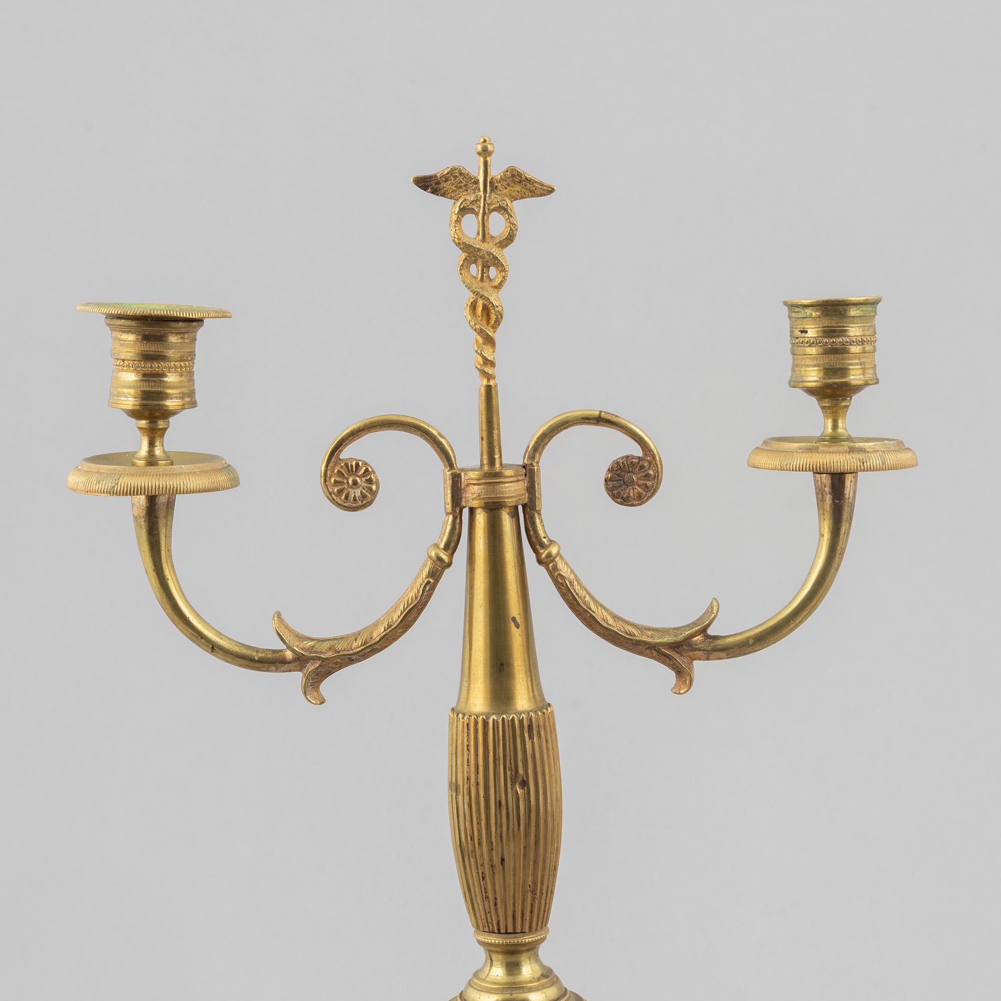 A pair of brass candelabra, first half/mid 19th century.
