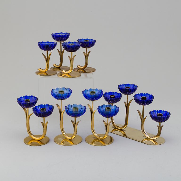 GUNNAR ANDER, 8 brass candlesticks. Ystad Metall, mid 20th century.