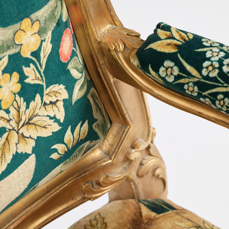 A pair of Louis XV-style giltwood fauteuils, late 19th century.