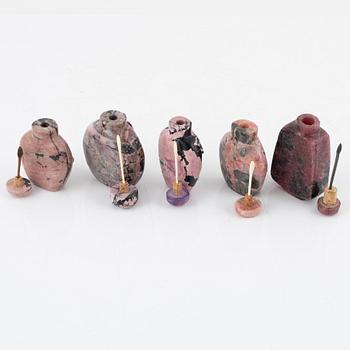 Nine Chinese snuff bottles in mottled stone, 20th century.