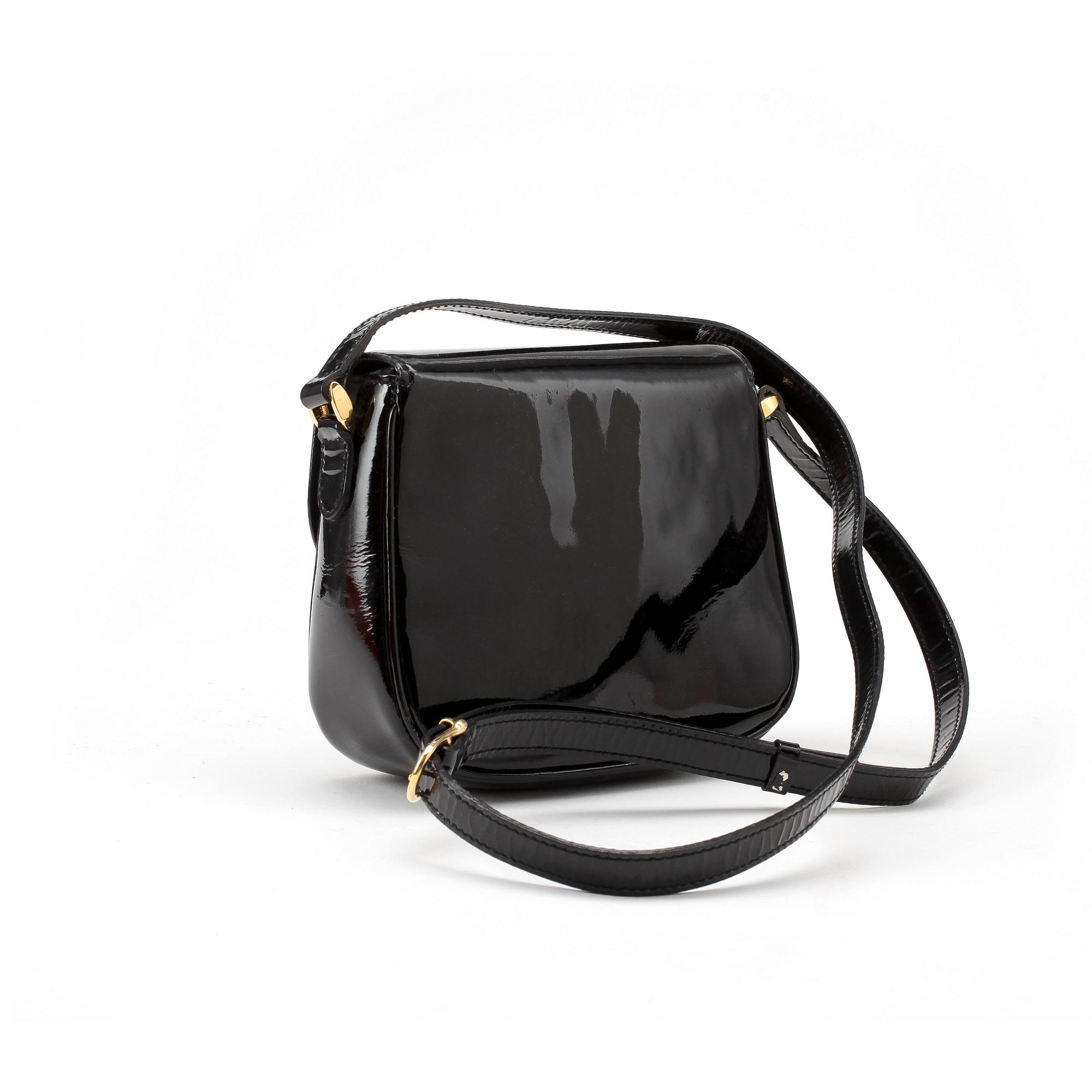 CÉLINE, a black leather patent shoulder bag.