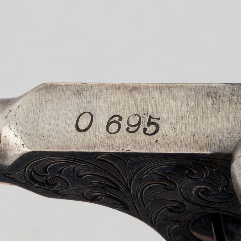 A percussion revolver, Colt 1851 Navy, in case, from the year 1863.