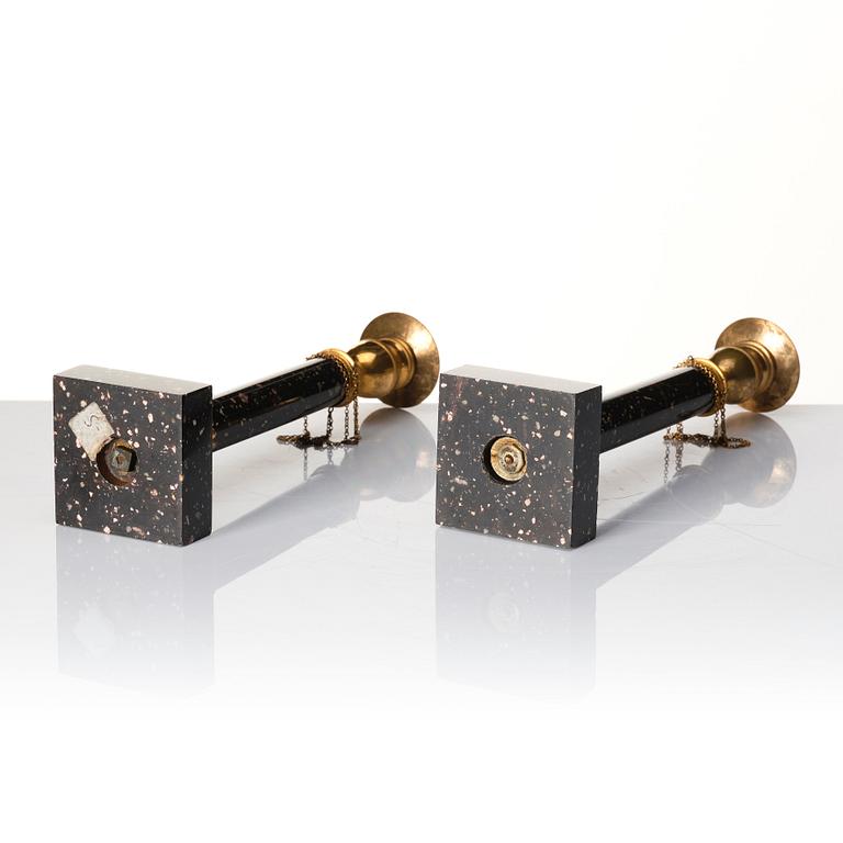 A pair of late Gustavian porphyry and gilt brass candlesticks, circa 1800.