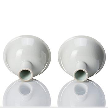 A pair of white glazed anhua stemcups, Qing dynasty, 19th Century.