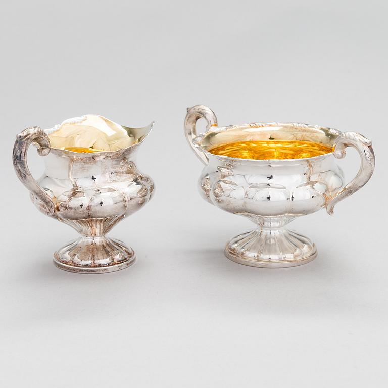 A silver coffee pot, a parcel-gilt sugar bowl and cream jug, Turku Finland 1946 and 1985.