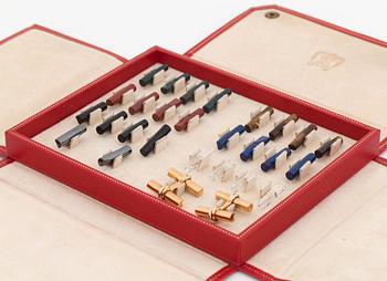 A pair of cufflinks signed Cartier with changeable  details in different gemstones.