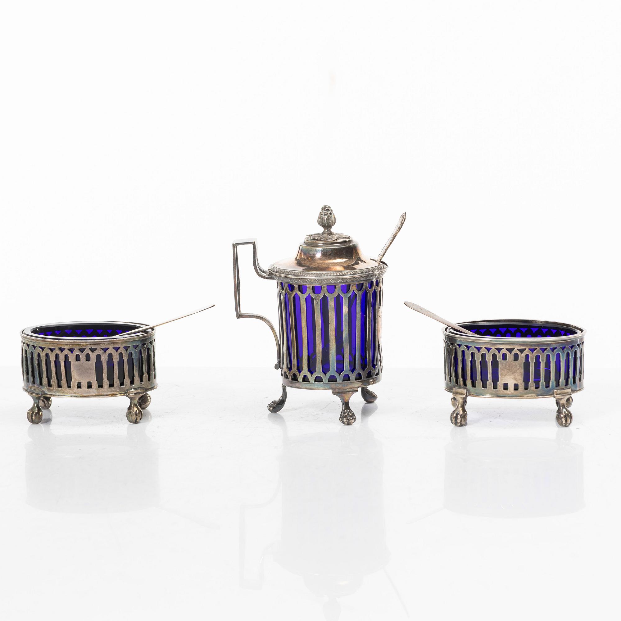 Two silver salt cellars, and a mustard pot, French hallmarks, late 18th Century.