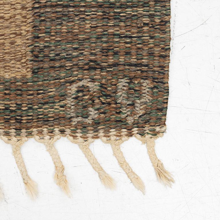 A flat weave carpet, signed, ca. 243 x 165 cm.