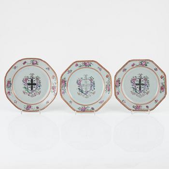 A set of three famille rose armorial dinner plates, Qing dynasty, 18th Century.