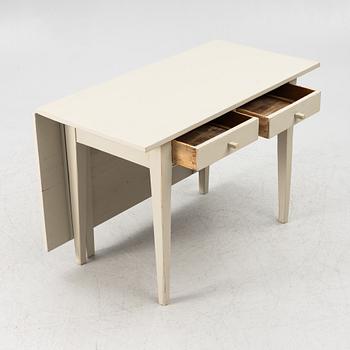 A drop-leaf table, late 19th century.