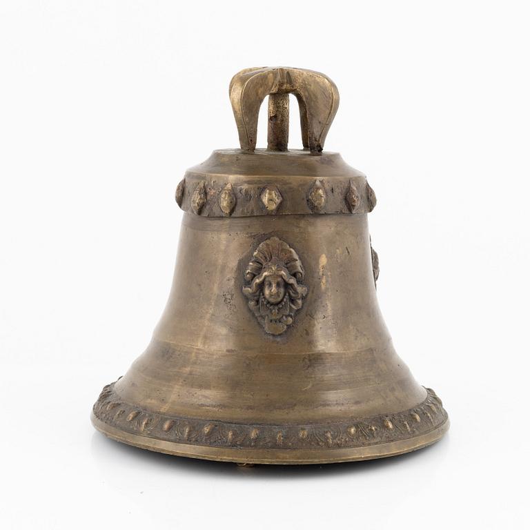 Vällingklocka, mässing, daterad 1879.