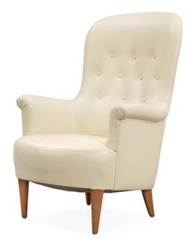 594. A Carl Malmsten 'Marino' white leather easy chair.