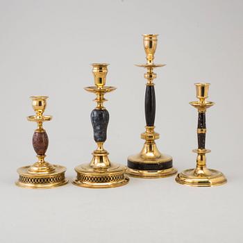 CARL HJALMAR NORRSTRÖM, after. Four brass and stone candlesticks from Skultuna, numbered 161/300, 1997.