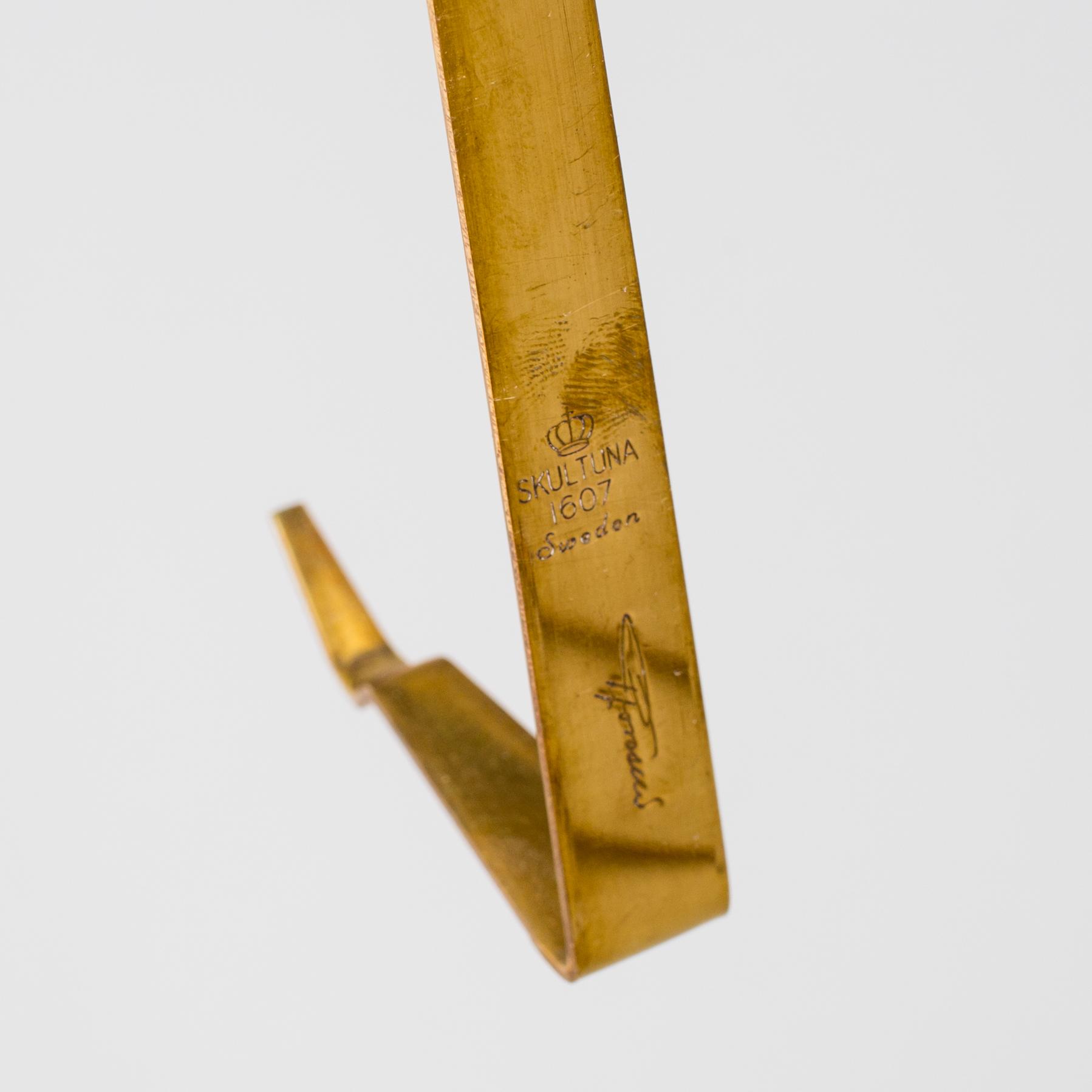 PIERRE FORSSELL,  three 'Pendeln' brass wall sconces from Skultuna.