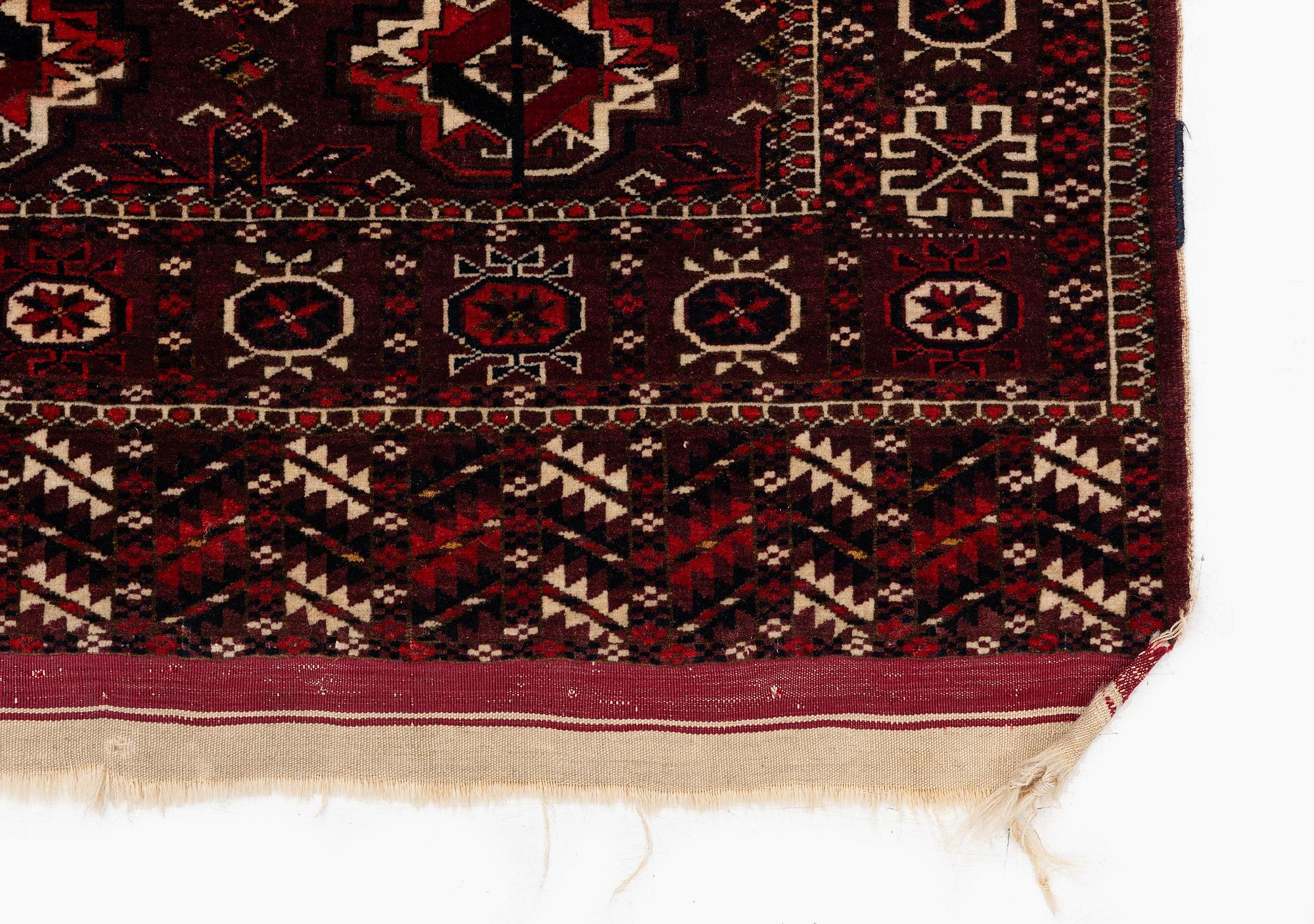 An antique Yomut rug, Western Turkmenistan, c. 119 x 104 cm.