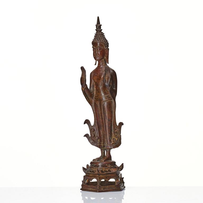 A standing sculpture of buddha, Laos, 18th Century.